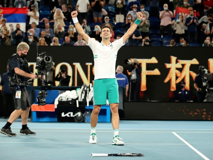Serbia's Novak Djokovic celebrates after winning the men's singles final against Russia's Daniil Medvedev at Australian Open in Melbourne Park in Melbourne, Australia, Feb. 21, 2021.